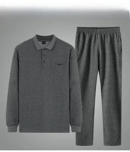 Detailed view of gray knit texture on middle-aged men's long sleeve polo and pants set