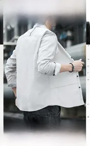 Detail shot of men's slim fit long sleeve shirt showing back tailoring and grey fabric texture