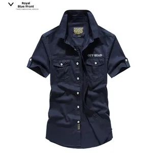 Detail of royal blue short sleeve cargo shirt featuring double chest pockets and embroidery