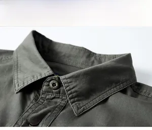 Close-up of olive green work shirt collar with twill texture and fashion buttons