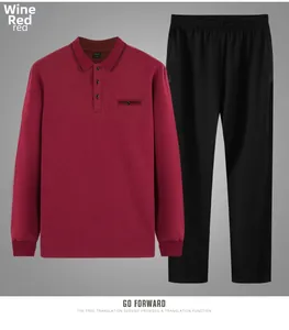 Detail of burgundy long sleeve polo shirt with chest pocket and black casual trousers