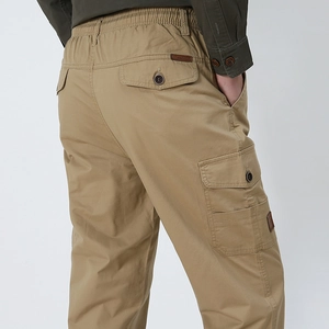 Men's khaki cargo pants with elastic waist and multi-pocket utility design for outdoors