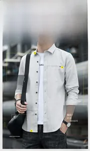 Detail view of men's casual long sleeve grey shirt with classic collar and chest pocket