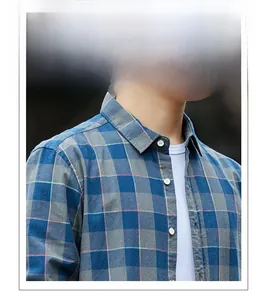 Detail of blue and grey plaid cotton flannel shirt fabric with soft brushed texture