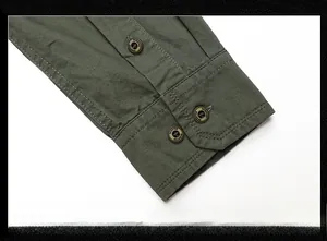Detail of military green cotton shirt cuff with stitching and fashion buttons