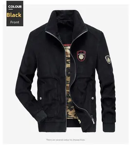 Detail of black corduroy jacket showing embroidered patch and camouflage lining