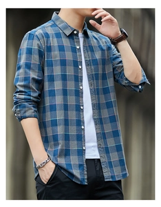 Detailed close-up of blue and grey plaid cotton long sleeve shirt for men in city street view