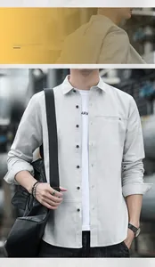 Detail view of men's light grey long sleeve shirt with cotton-linen texture and pocket