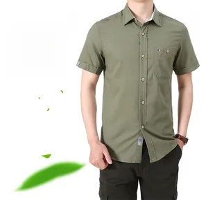 Detail of army green short sleeve shirt showing the classic collar and chest pocket logo