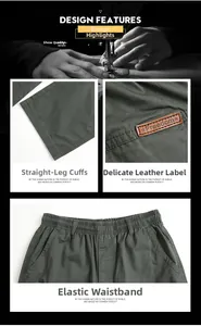 Detail view of men's dark grey straight trousers featuring elastic waist and leather patch