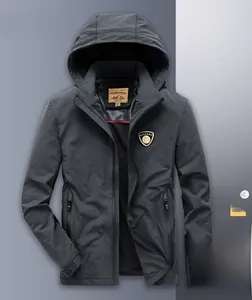 Close-up of men's dark grey hooded windbreaker featuring brand logo and zipper detail