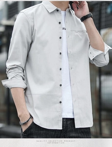 Detail of light gray long sleeve shirt with chest stitching and dark buttons for men