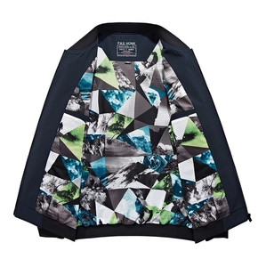 Detail of navy casual jacket featuring breathable mesh lining with colorful outdoor geometric prints