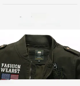 Detailed close-up of the ribbed collar and embroidery on a green cotton cargo jacket
