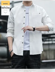 Detail of white long-sleeved shirt featuring fine pocket stripe and chest pocket design