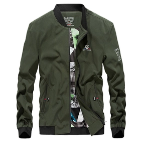 Detail of dark green bomber jacket showing ribbed collar, chest logo, and military patches