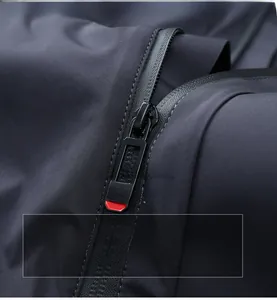 Detail view of smooth fabric texture and durable zipper on men's winter padded jacket