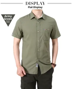 Detail shot of army green short sleeve shirt showing wood texture buttons and chest pocket