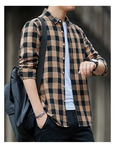 Close-up detail of a brown and black plaid pattern on a casual men's long-sleeve cotton shirt