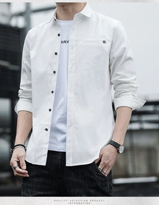 Close-up of white business casual shirt with black buttons and small chest pocket detail