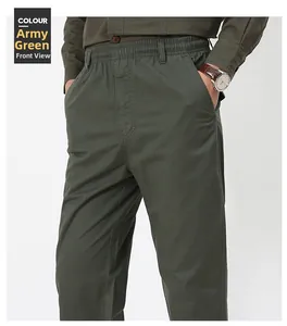 Detail of army green casual trousers featuring elastic waist and slanted side pockets