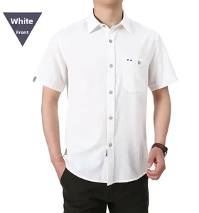Detail of white cotton shirt with pocket, colored tag, and wooden textured buttons