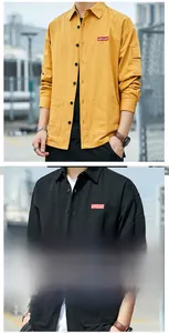 Detail of men's cargo shirt showing chest logo, pockets, and textured fabric finish