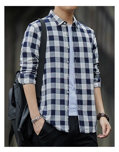 Close-up of men's blue and white plaid cotton shirt with button collar and casual styling