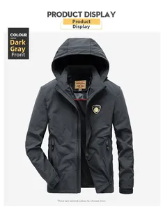 Detail view of dark grey windproof jacket featuring front zipper and brand shield logo