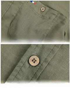 Detailed view of olive green linen shirt featuring chest pocket and wood texture buttons