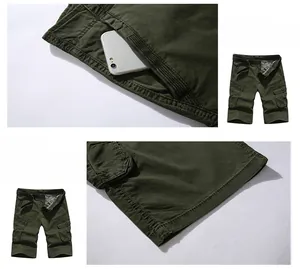 Detail of army green cargo shorts with twill fabric texture and woven belt accents