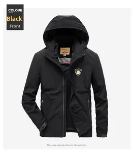 Detail of black outdoor jacket featuring adjustable hood and metallic shield logo