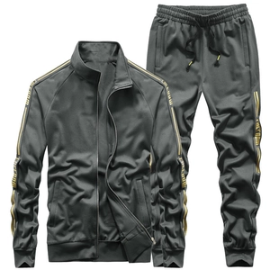 Men's dark gray outdoor sports track suit with gold side stripes and freedom lettering