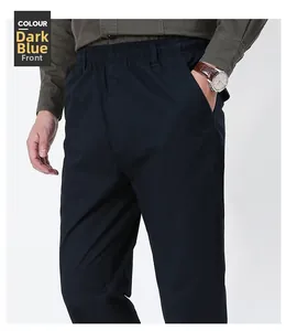 Detail of men's dark blue straight casual pants with elastic waist and belt loops