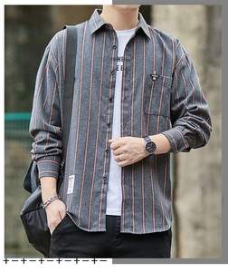 Detail of grey men's long sleeve striped shirt featuring a chest pocket and fashion labels