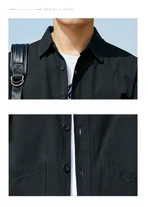 Detail of square collar and embroidered chest logo on black cotton workwear shirt