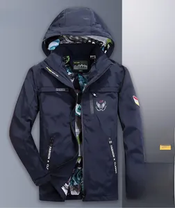 Detail of navy blue windbreaker featuring camouflage lining and fashion zippers