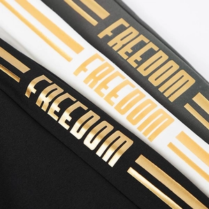 Men's outdoor sports suit detail featuring Freedom gold foil print on black and white fabric