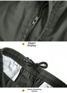 Detail of olive green casual pants showing the smooth zipper and elastic drawstring waist