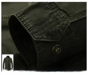 Close-up detail of reinforced cuffs and vintage metal button on men's green cotton canvas jacket