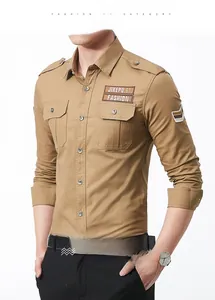 Detail of military-style khaki shirt showing double chest pockets and arm patch labels