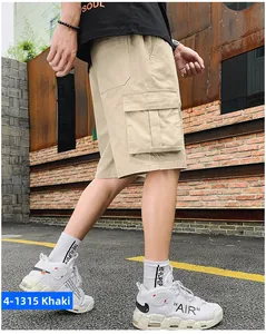 Detailed side view of khaki cargo shorts featuring functional flap pockets and durable cotton