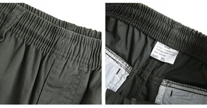 Detailed view of elastic waistband and 100% cotton wash label on army green casual pants