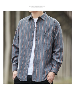 Close-up of men's dark grey casual long-sleeve striped shirt with chest pocket detail
