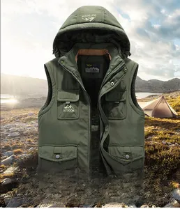 Detail view of military green hooded vest showing outdoor mountain logo and utility pockets