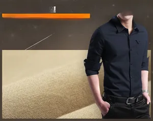 Detail showing the navy blue cotton shirt texture with collar and button pocket