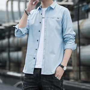 Men's light blue long sleeve casual shirt with striped pocket detail in urban style