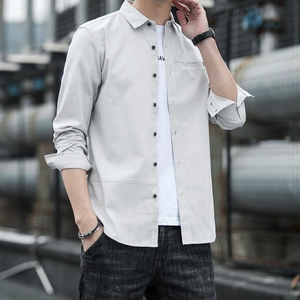 Men's light grey long-sleeve casual shirt with contrast buttons and chest pocket detail