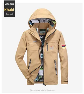 Detail of khaki outdoor hooded jacket with embroidered logo and camouflage trim lining