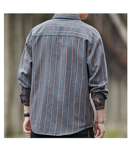 Detail of grey and orange striped shirt with contrasting horizontal back yoke stitching